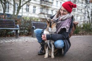 Dog showing love towards its owner and kissing her